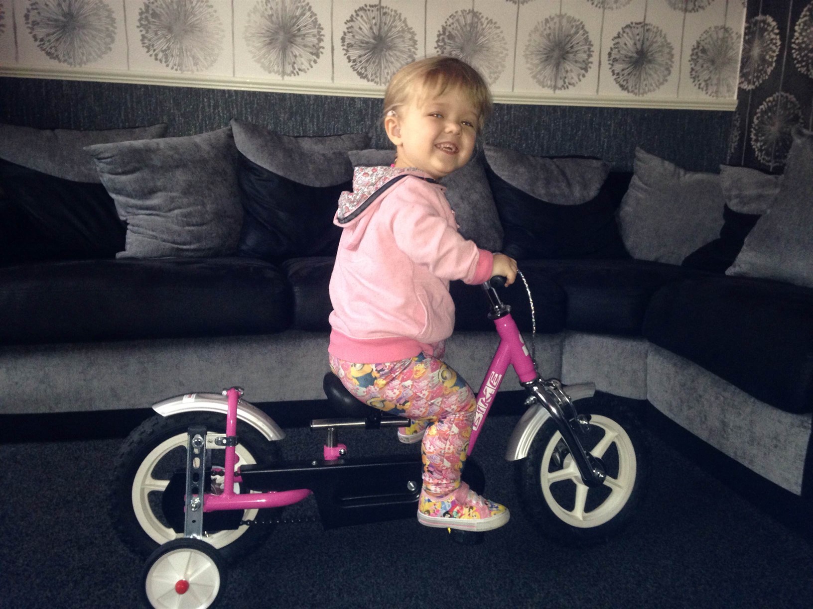 Abi on her pink bicycle