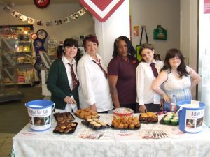 Group of women at a charity bake sale in Sainsbury's