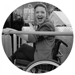 Dr Hannah Barham-Brown smiling in her wheelchair