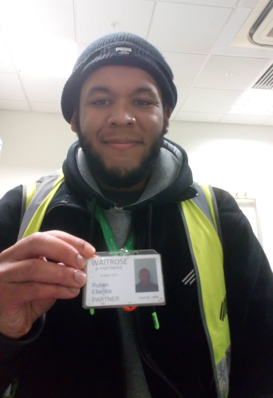 Ruben holding his new work ID