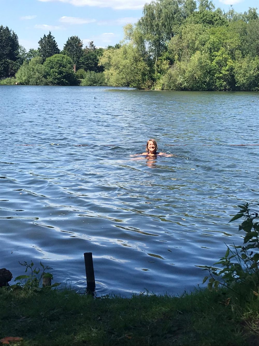 Caroline wild swimming in a lake